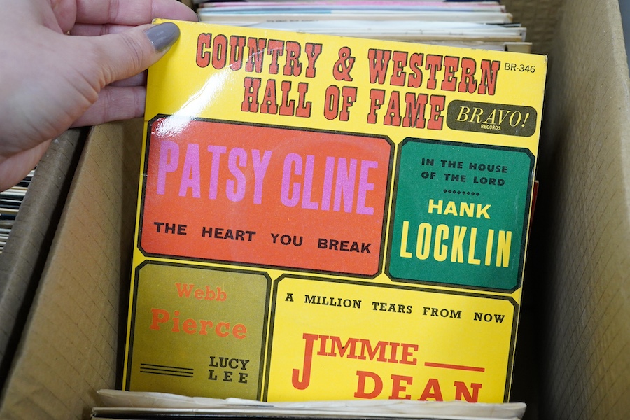 Four boxes of 7 inch singles, record labels include; Columbia, Parlophone, RCA, London, Brunswick, HMV, etc., artists include; Hank Williams, Ray Charles, the righteous brothers, Bill Haley and His Comets, Chuck Berry, A